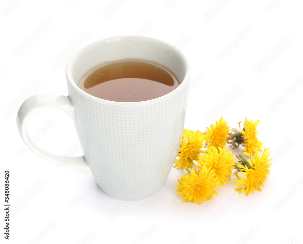 Cup of healthy dandelion tea on white background