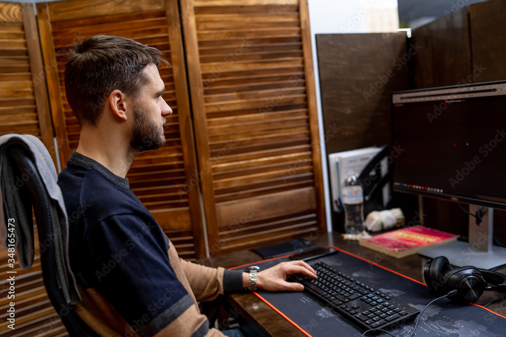 Handsome young programmer working in office. Developing programming and coding technologies.