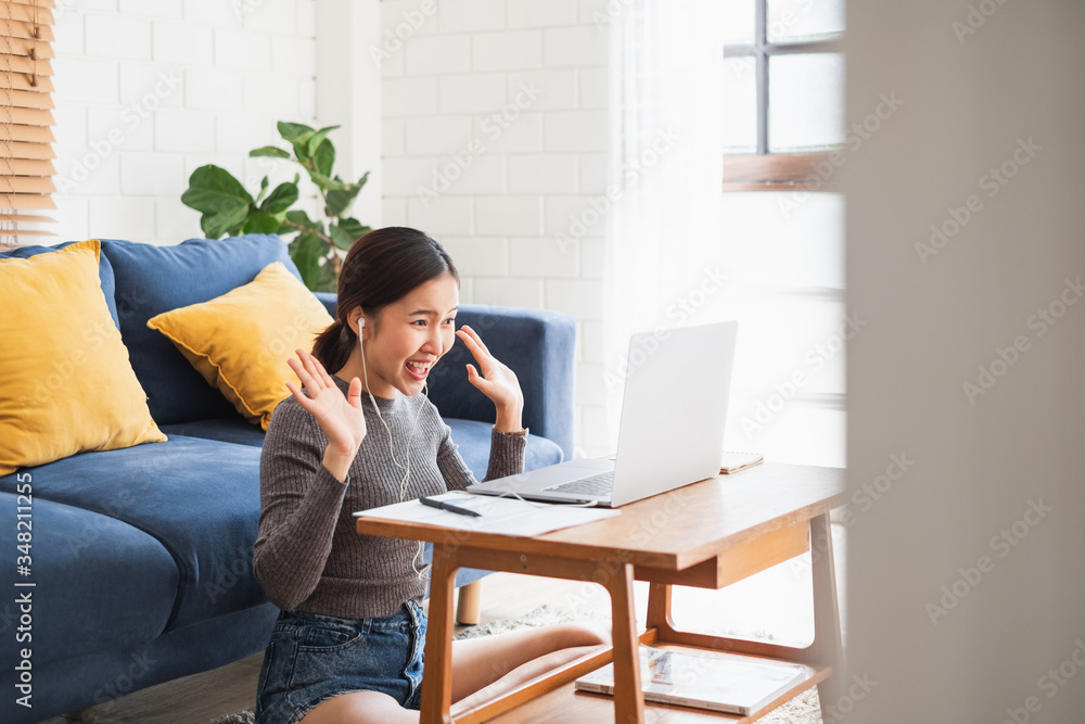 Young Asian businesswoman work at home and virtual video conference meeting with colleagues business