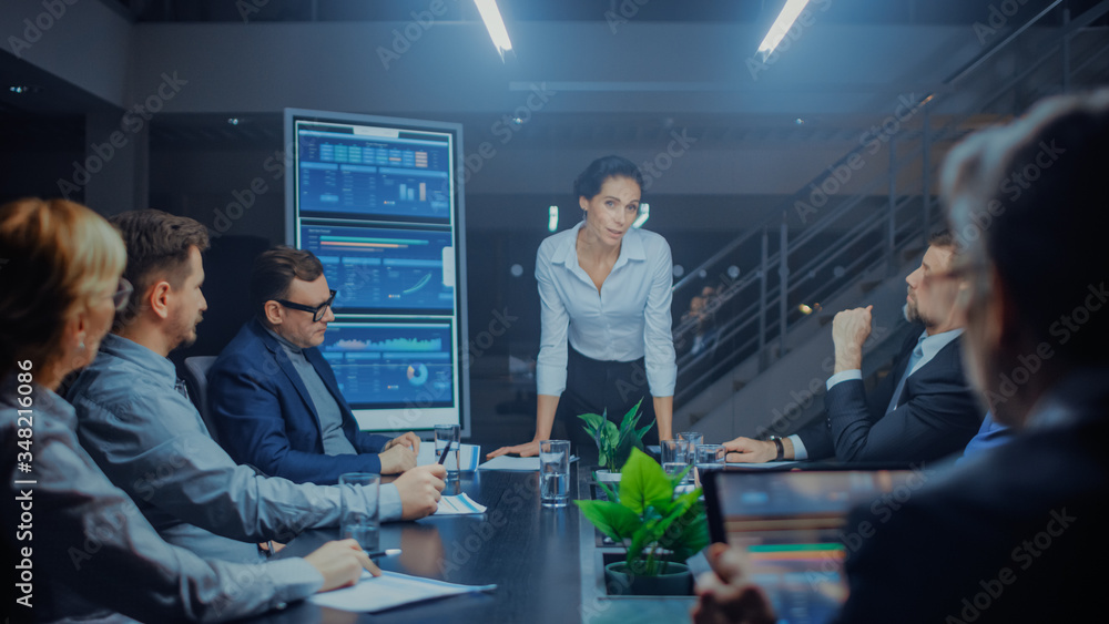 Late at Night in Meeting Room: Confident Female Executive Director Stands in the Head of the Confere