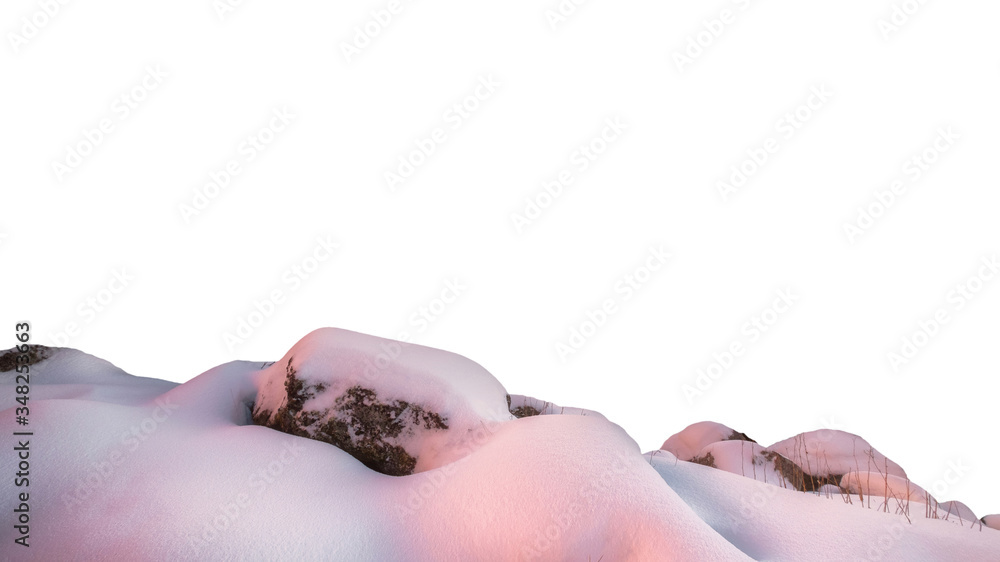 Colorful sunrise on snowy hill with rocks in winter on background