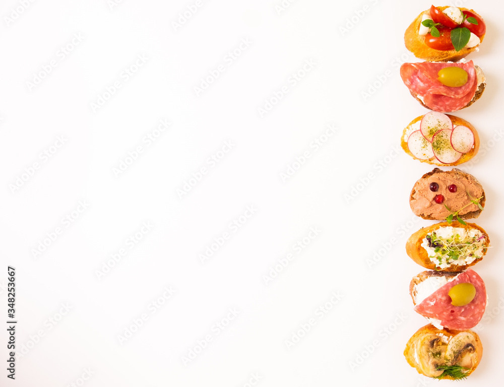 Assorted bruschetta with various toppings.Appetizing bruschetta. Mix bruschetta Variety of small san