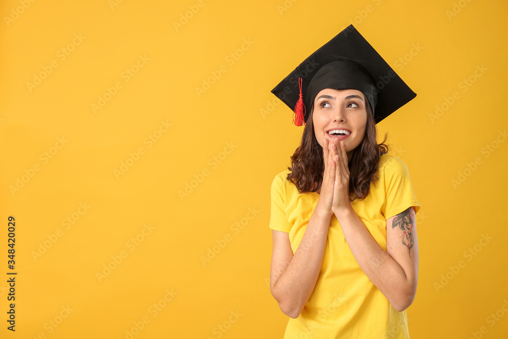 Female graduating student on color background