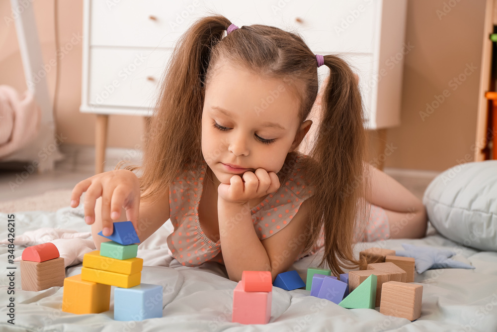 Little girl playing at home