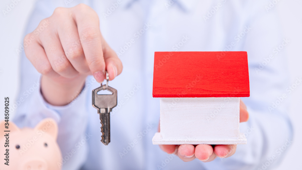 Business concept - Young Asian woman in blue shirt sale house, home insurance, loan, tax with signed