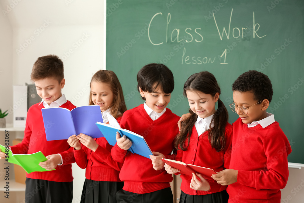 Cute little pupils in classroom