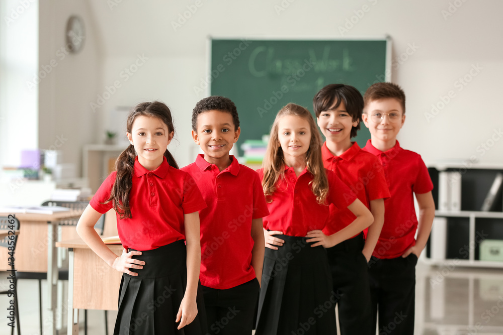 Cute little pupils in classroom