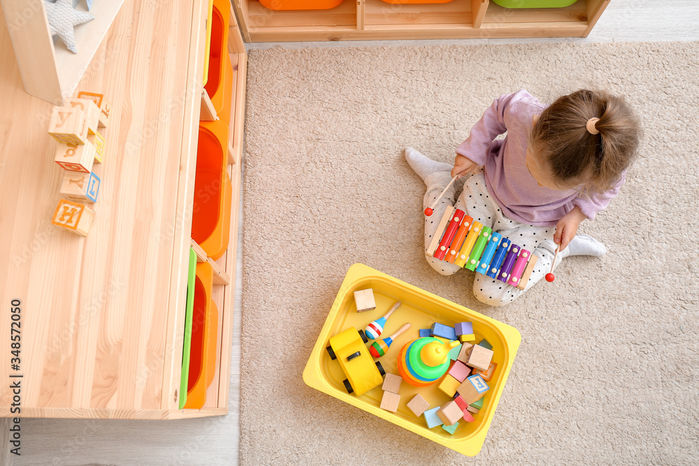 Little girl playing at home