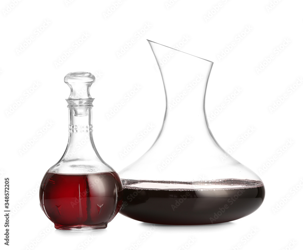 Decanters of wine on white background