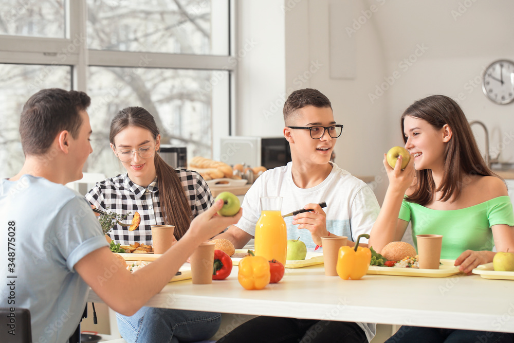 Pupils having lunch at school canteen