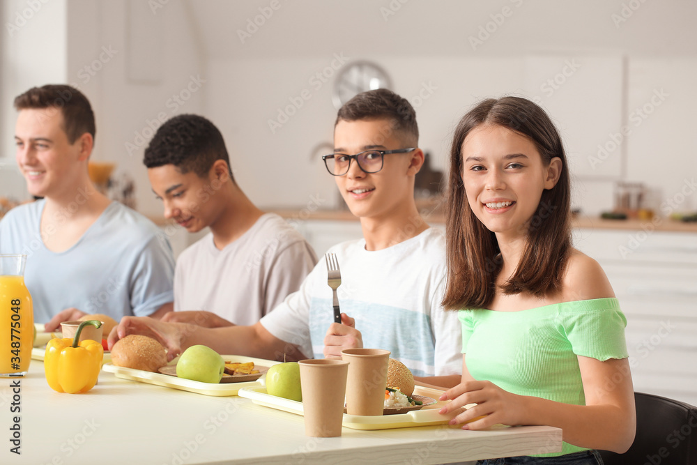 Pupils having lunch at school canteen