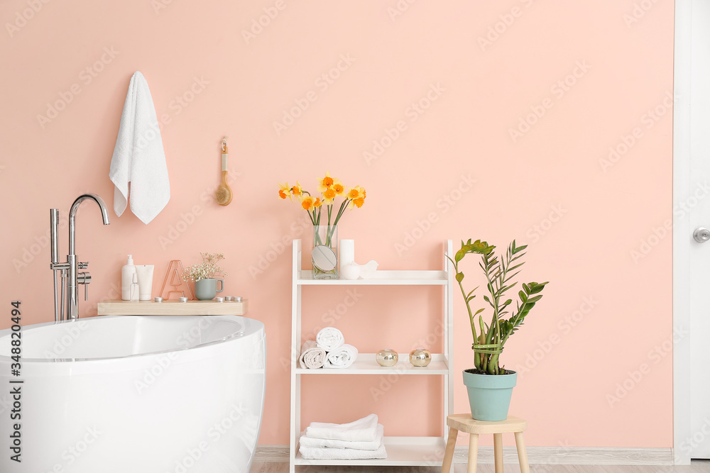 Interior of bathroom with fresh flowers