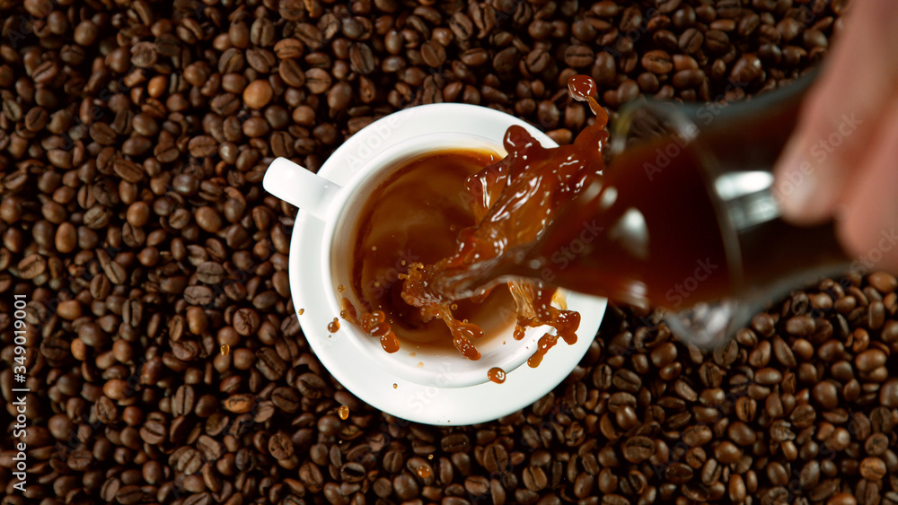 Pouring a cup of hot coffee, high angle of view