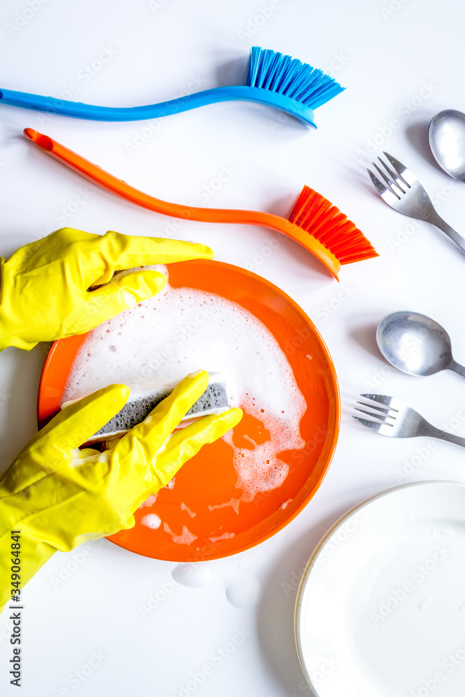 concept of woman washing dishes on white background