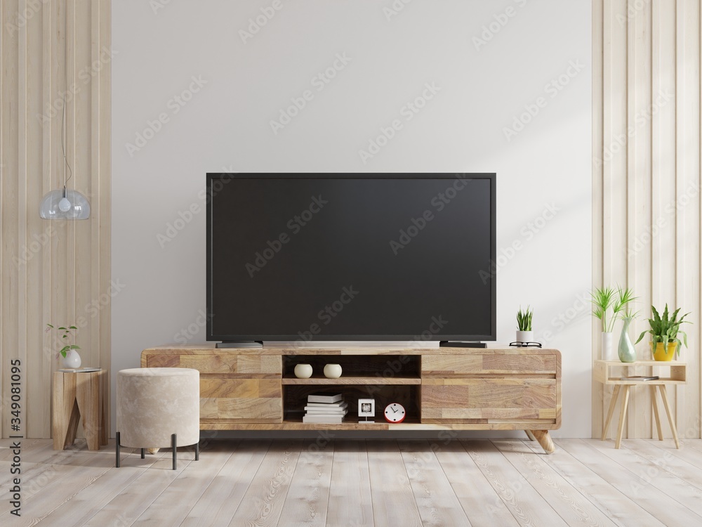 TV on the cabinet in modern living room on white wall background.