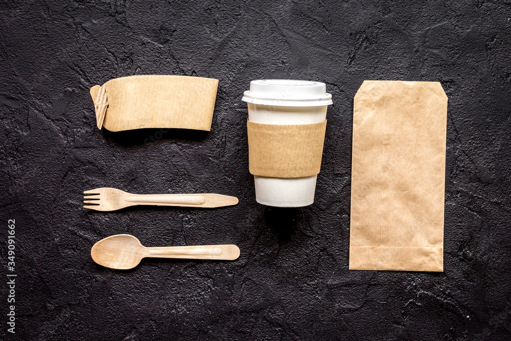 food delivery with paper bags and plastic cup on dark table background top view mockup