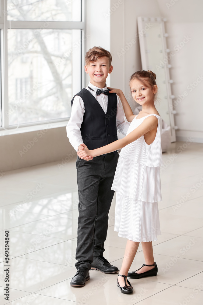 Cute little children dancing in studio