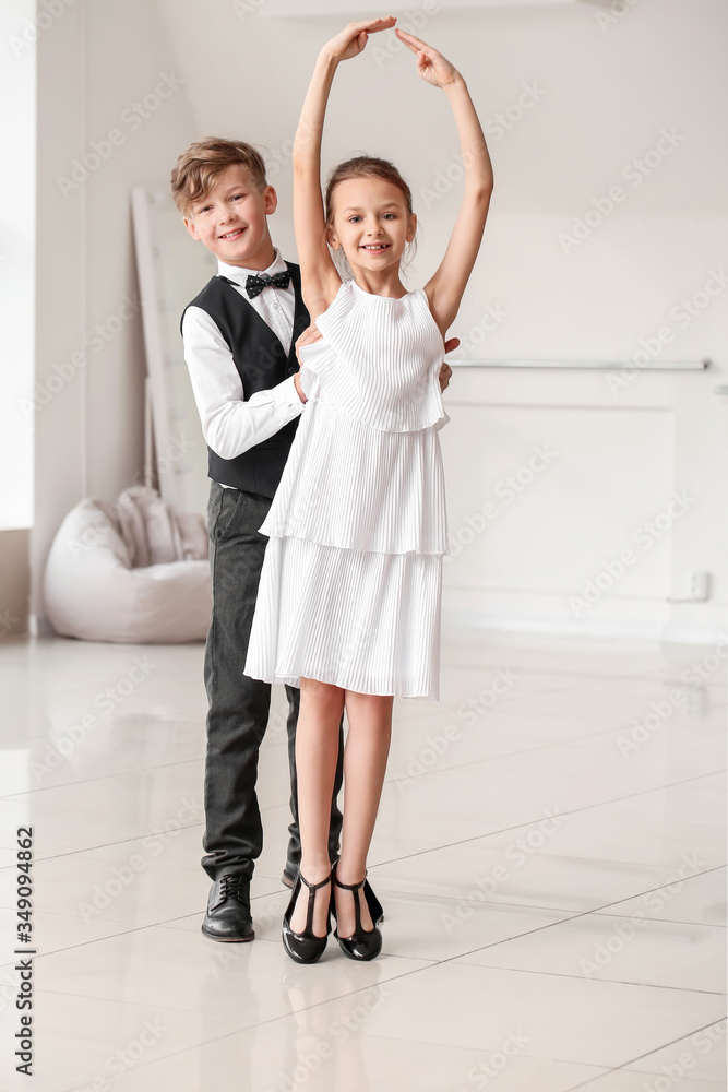 Cute little children dancing in studio