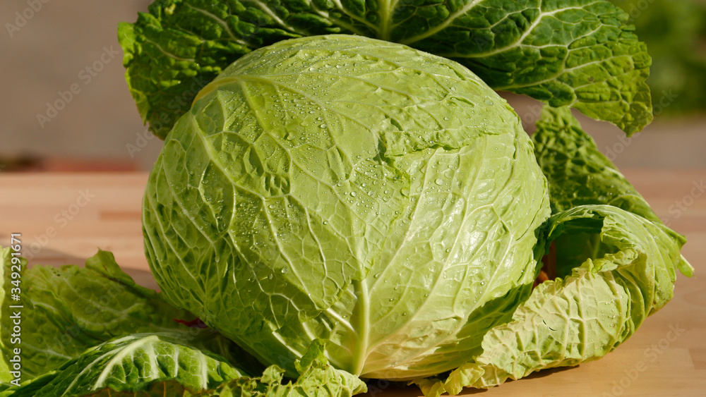 Closeup, cabbage, fresh organic green vegetables on wooden board, healthy eating