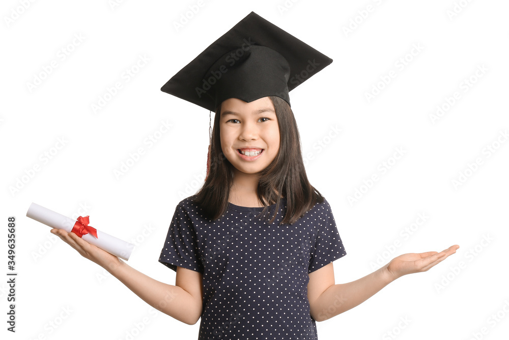 Little girl in graduation hat and with diploma on white background