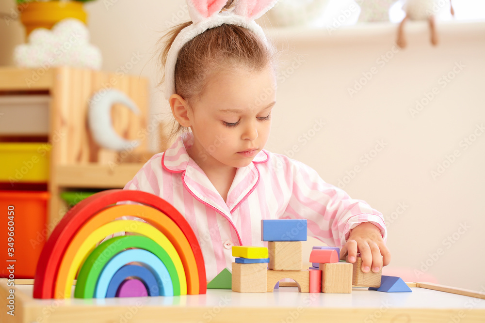 Little girl playing at home