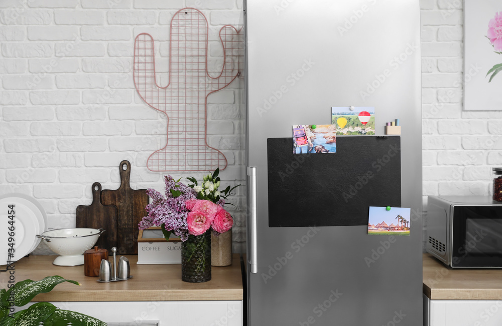 Chalkboard on door of refrigerator in kitchen