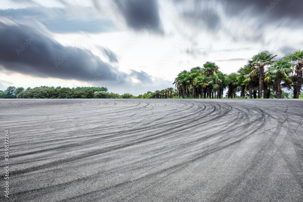 Race track road and forest with sky cloud landscape.Asphalt road background.