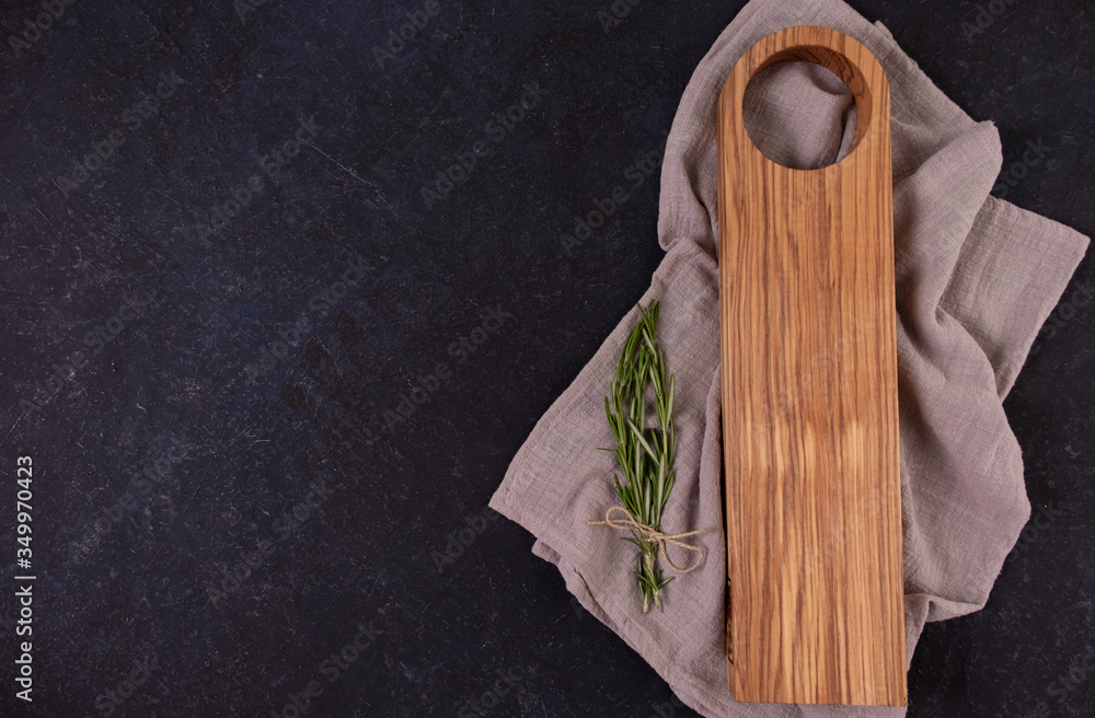 Empty cutting Board, on an old black table. Oak. Wood. Menu