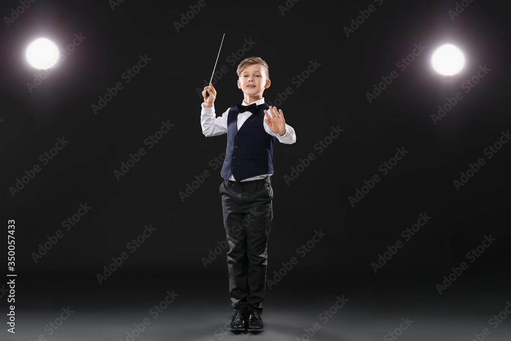 Little conductor on dark background