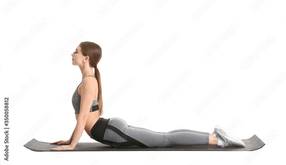 Sporty young woman training against white background