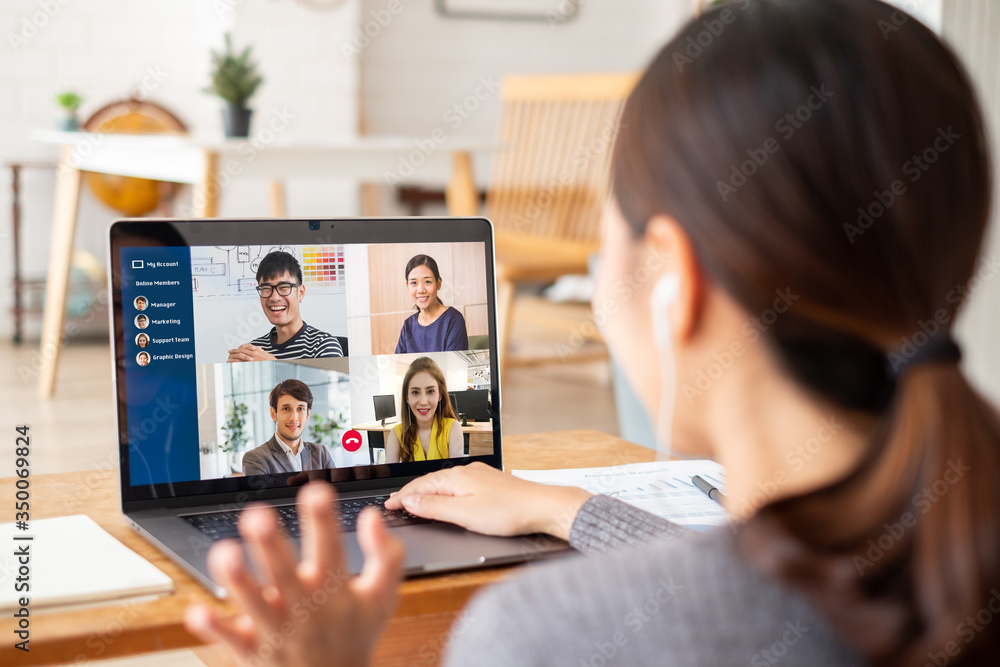 Young Asian businesswoman work at home and virtual video conference meeting with colleagues business