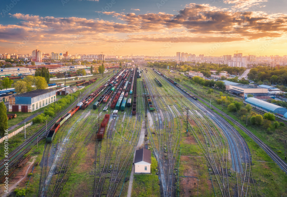 Aerial view of freight trains. Top view of railway station, wagons, railroad. Heavy industry. Indust