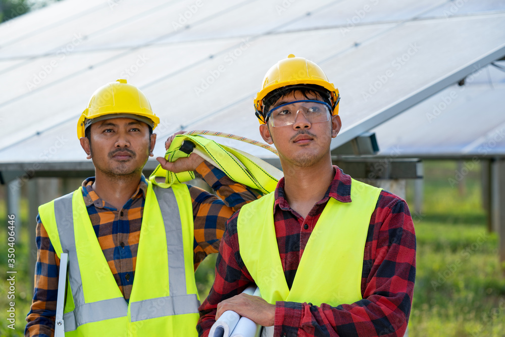 Group of engineer checking solar panel in routine operation at solar power plant,Operation and maint