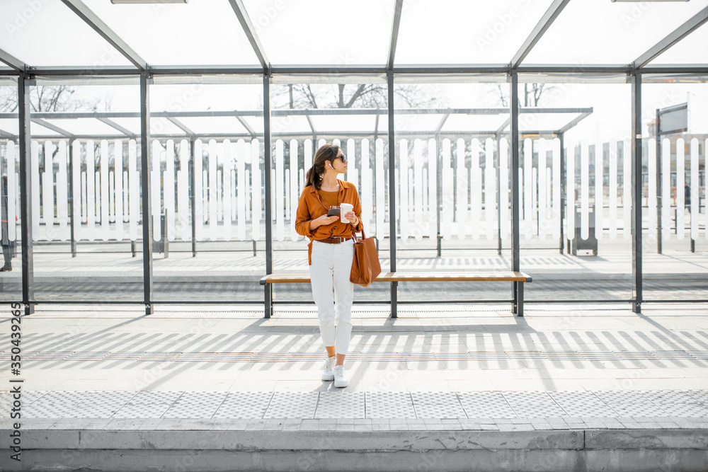 Woman at the public transport stop