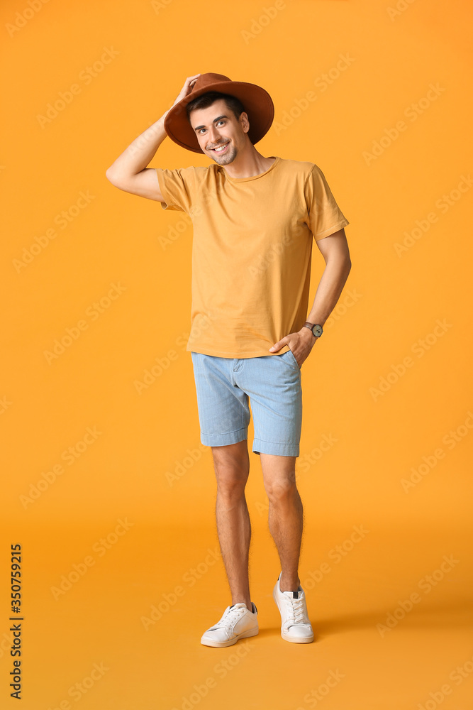 Man in stylish t-shirt on color background