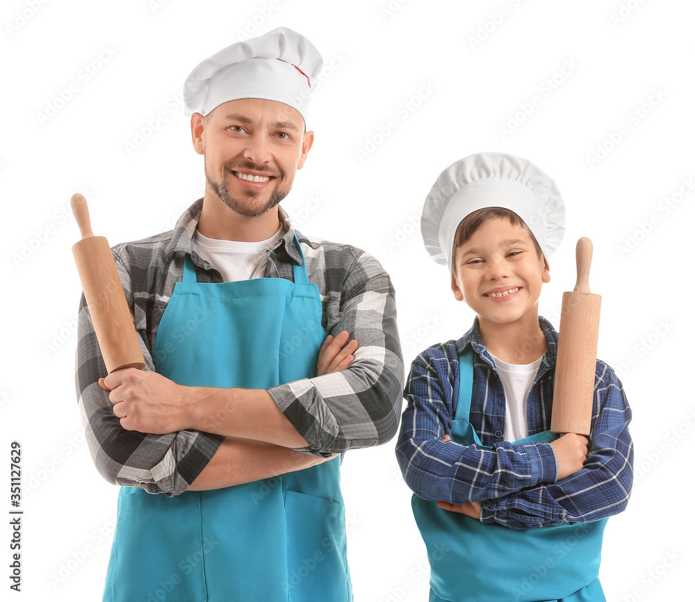 Portrait of male chef and his little son on white background