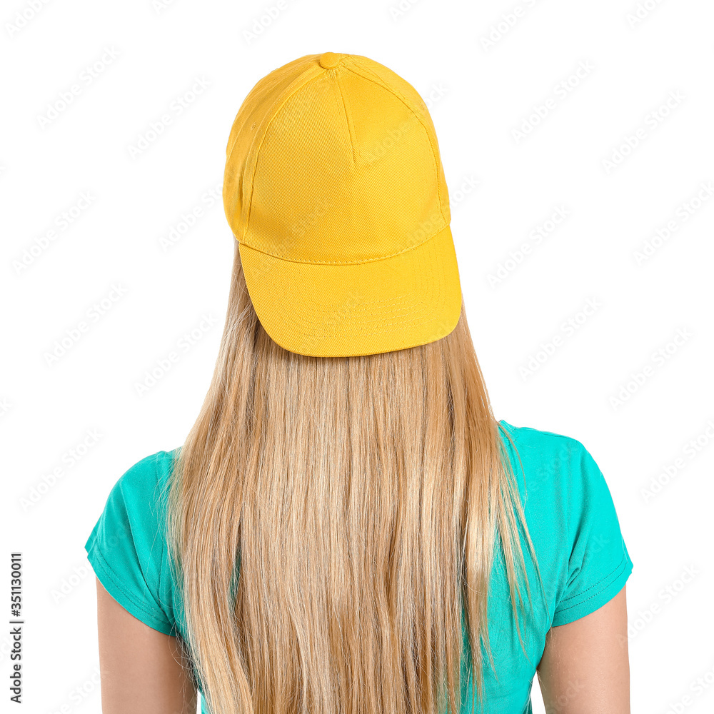 Beautiful young woman in stylish cap on white background