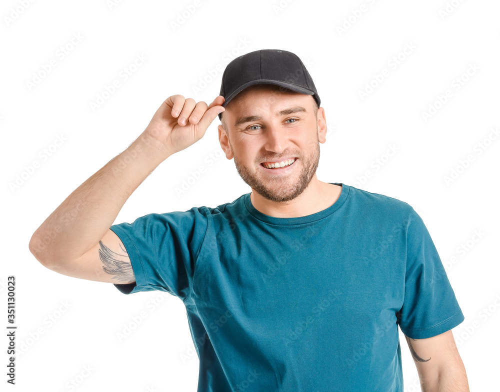 Handsome man in stylish cap on white background