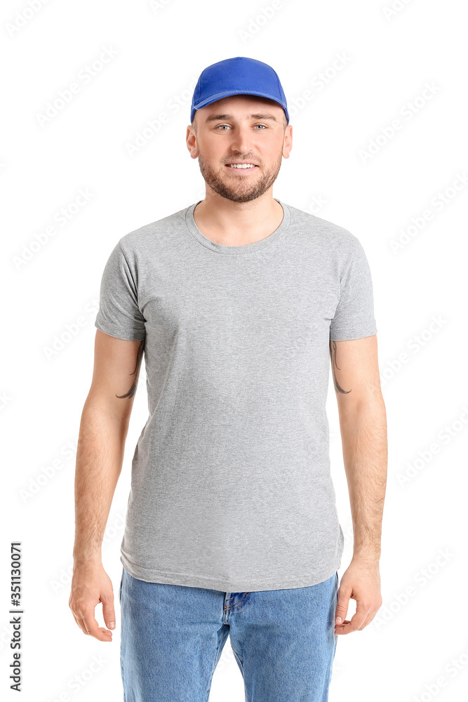 Handsome man in stylish cap on white background