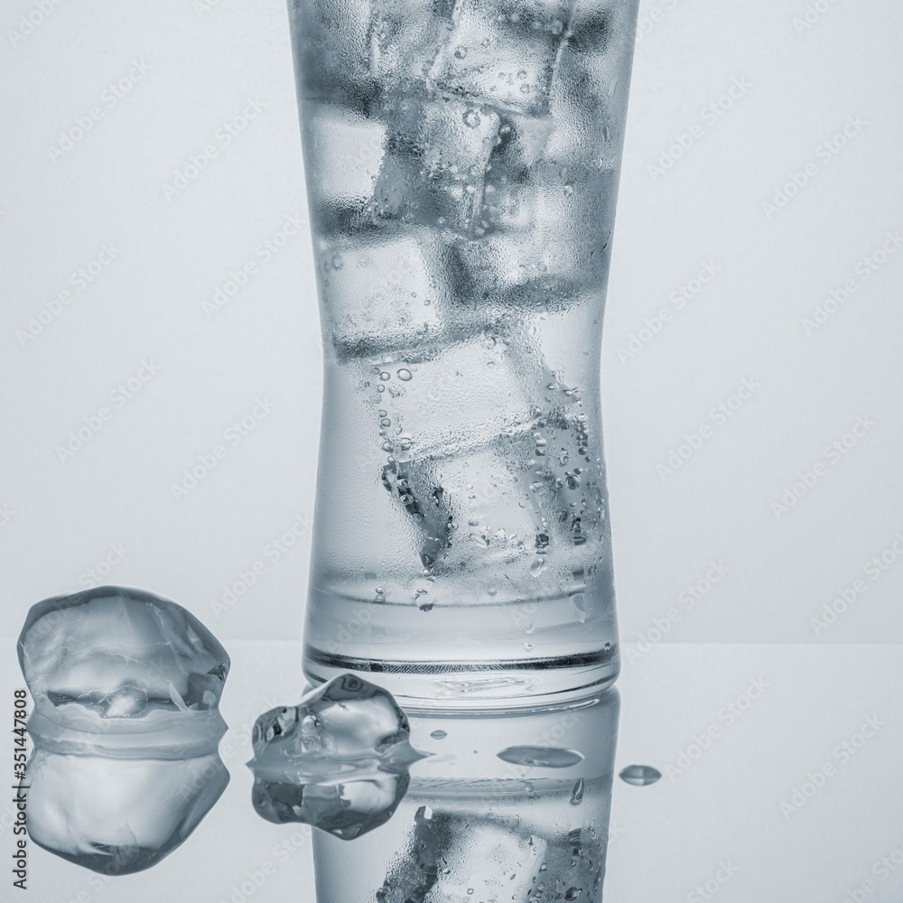 Glass of water with ice macro shot