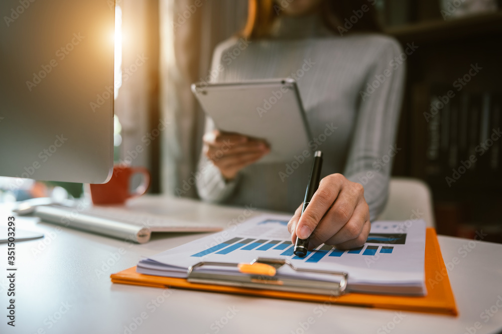 businessman hand working with new modern computer and writing on the notepad strategy diagram as con