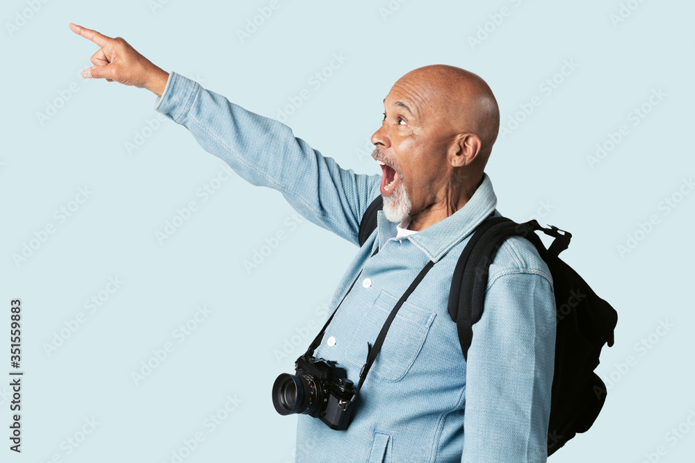 Excited black senior man with a digital camera mockup