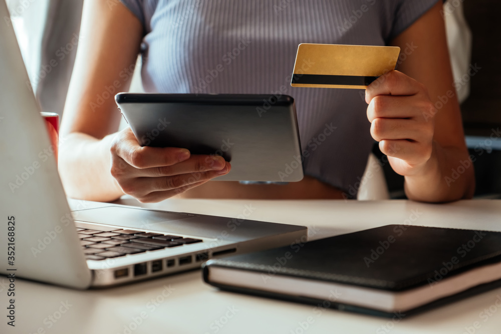 Business woman hands using smartphone and holding credit card with digital layer effect diagram as O