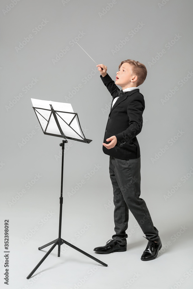 Little conductor on grey background