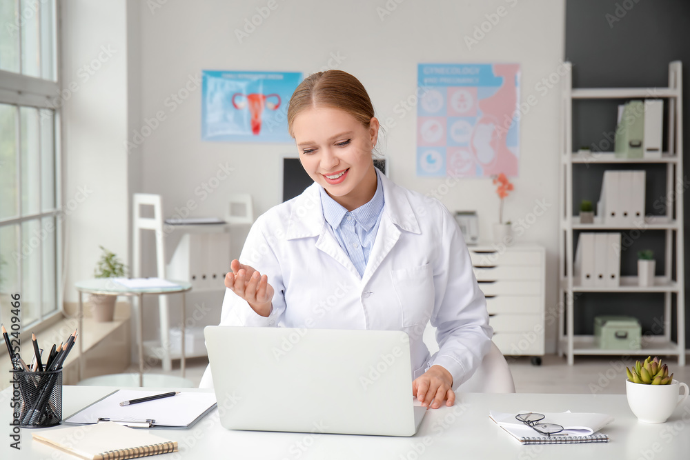 Female doctor giving a consultation online in clinic