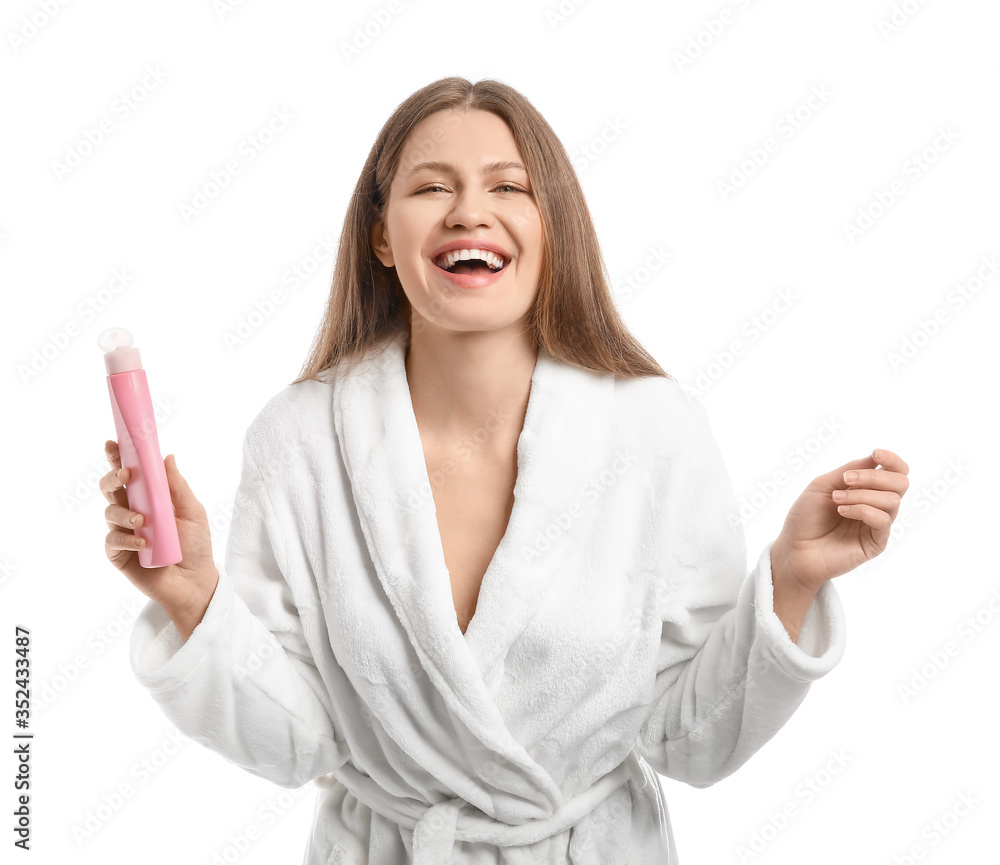 Beautiful young woman with shower gel on white background