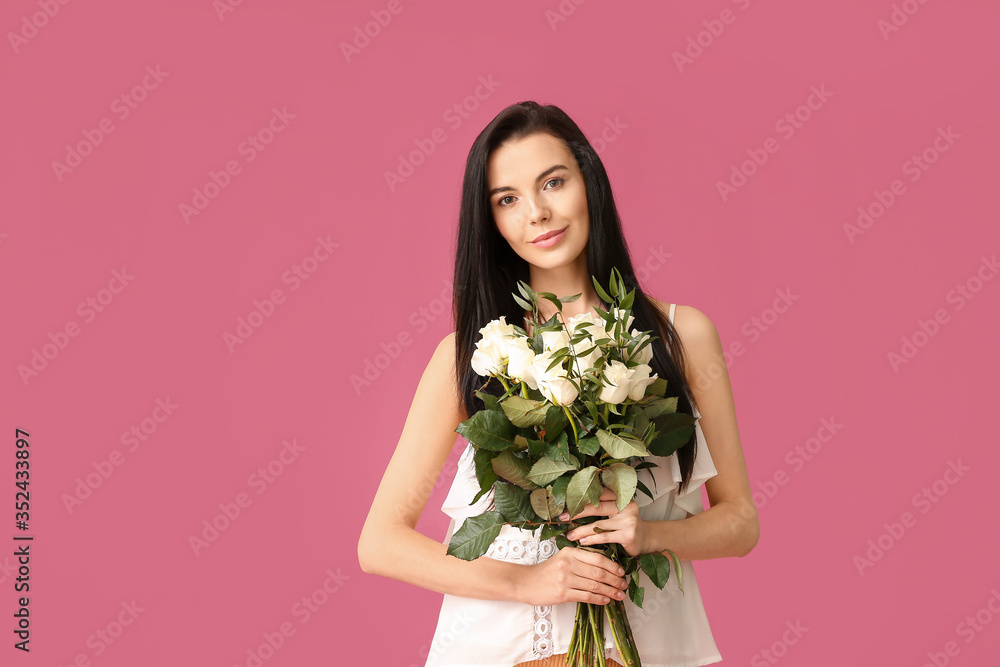 Beautiful young woman with bouquet of roses on color background