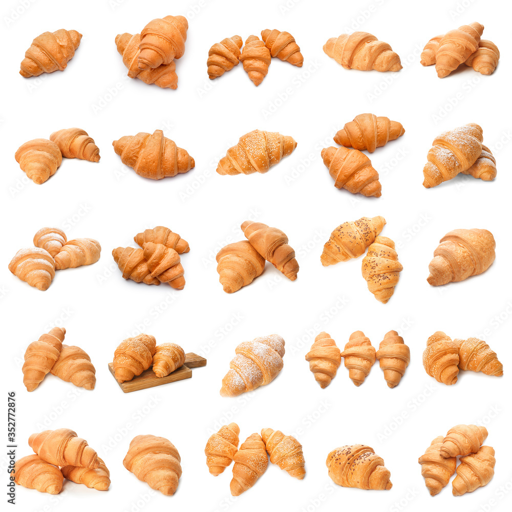 Many tasty croissants on white background