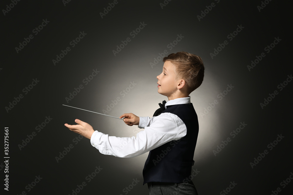 Little conductor on dark background