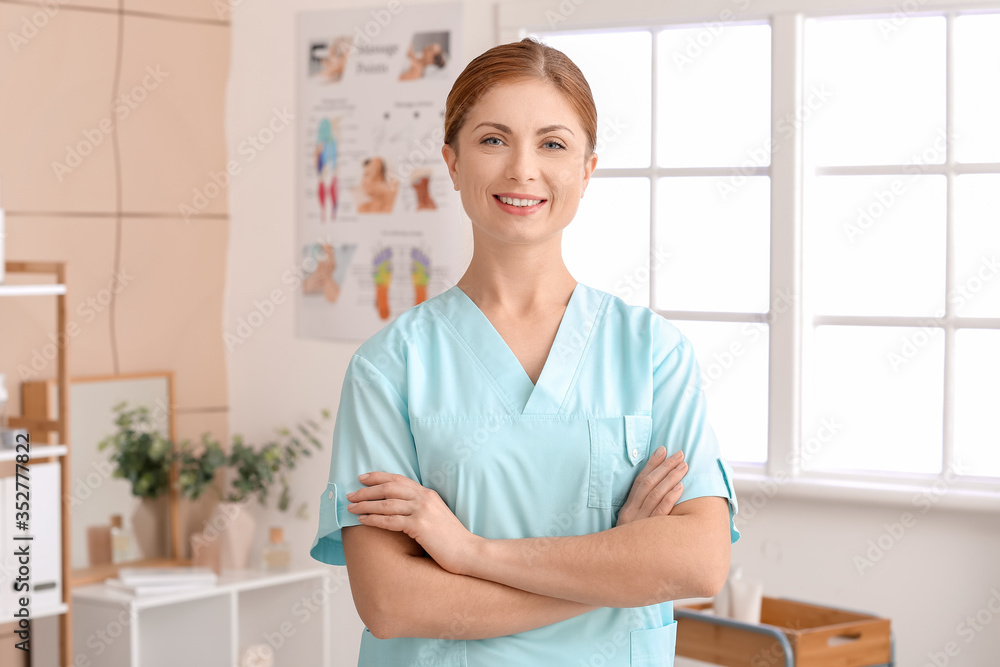 Portrait of massage therapist in medical center